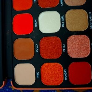 Eyeshadow palette box of 18 deep colors with eyeliner makeup